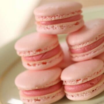 Close up of a stack of Pink French Macarons on a Plate