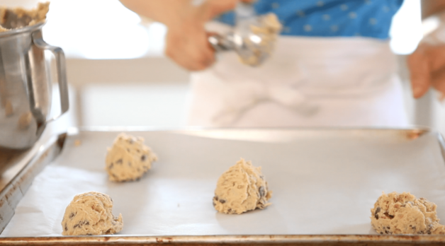 chocolate chip cookie dough scoop on cookie sheet