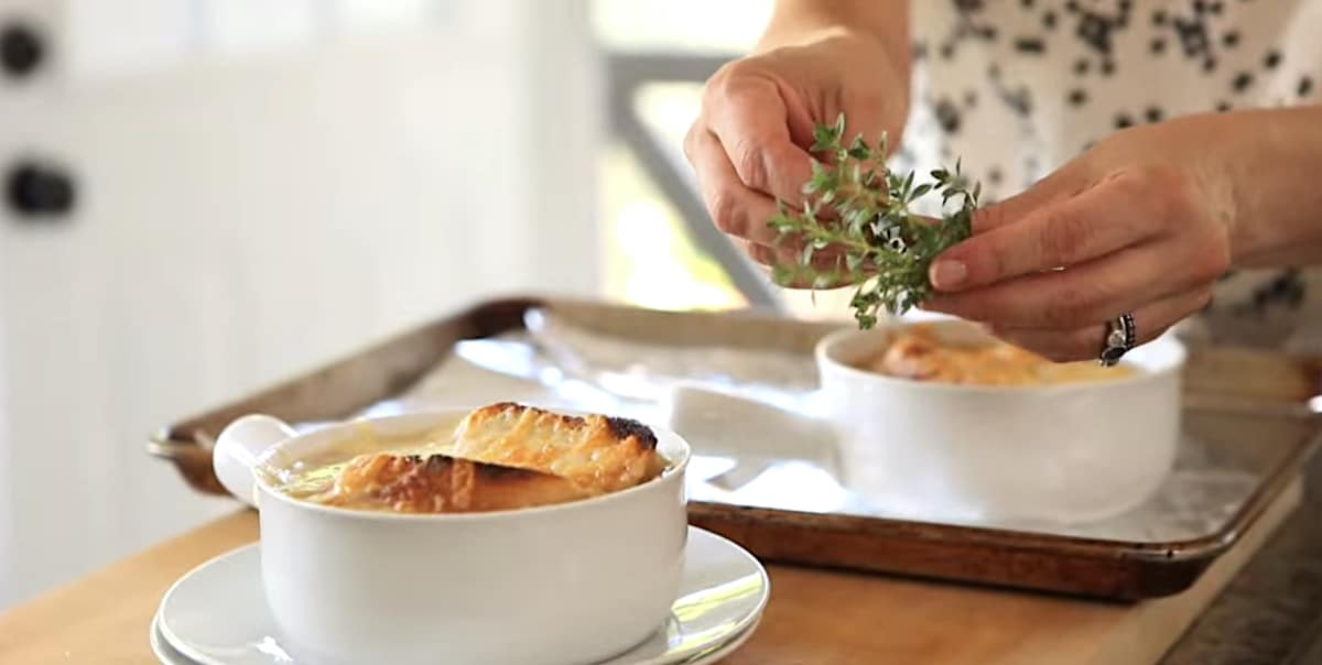Garnishing French Onion Soup with Thyme