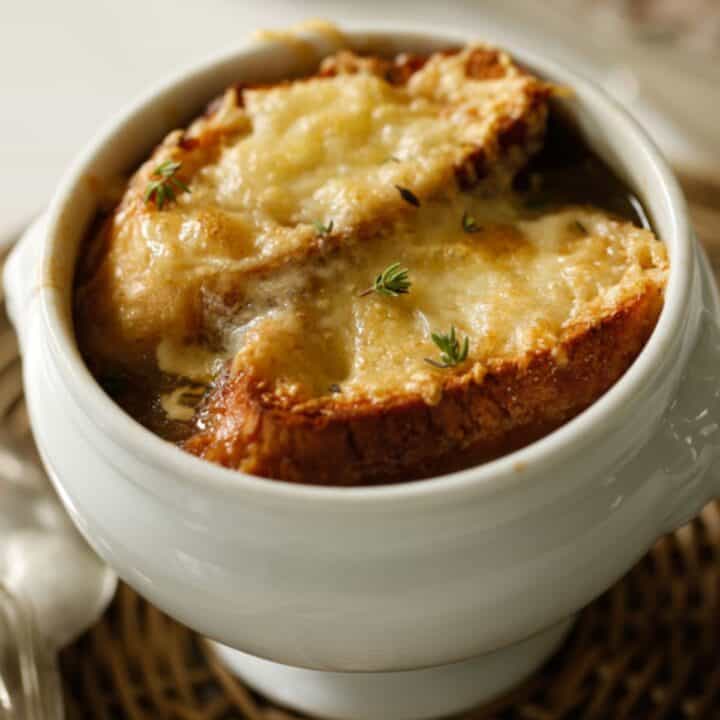 French Onion Soup in a White Lion's Head Bowl