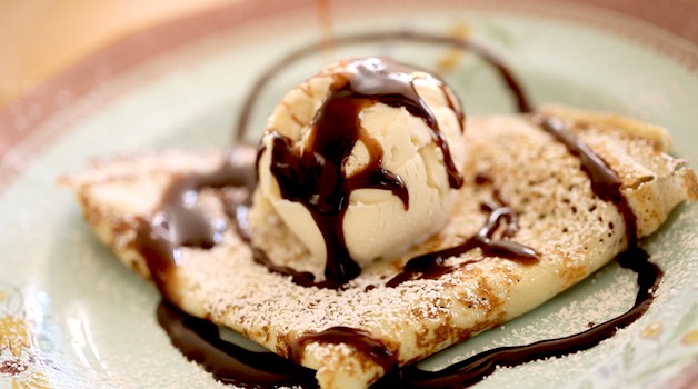 Folded crepe with vanilla ice cream and chocolate sauce