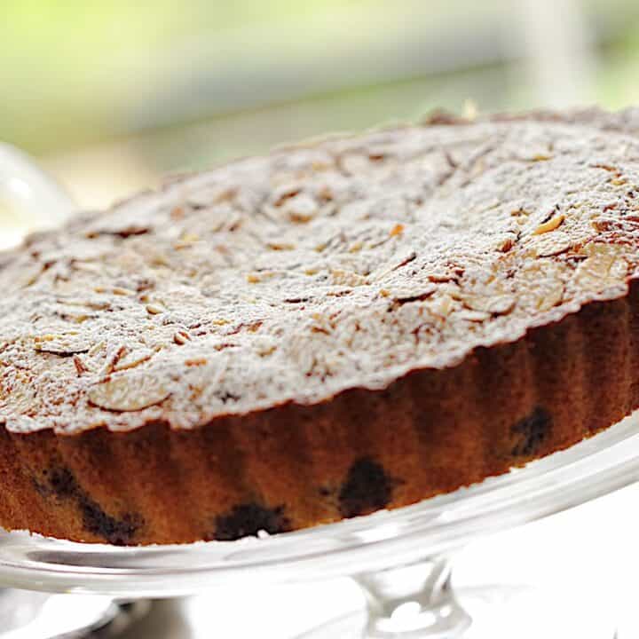 Blueberry Almond Tea cake on a Clear Cake stand