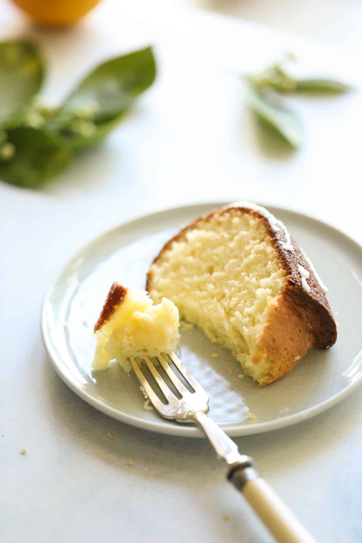 one plate of a slice of lemon cake with fork