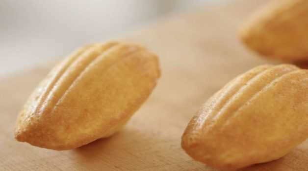 Scalloped detail of an Easy Madeleine Recipe lying on its hump