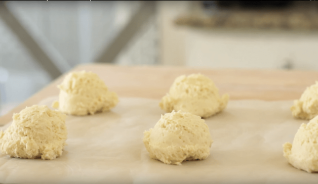 Strawberry shortcake dough formed into balls and placed on a cookie sheet