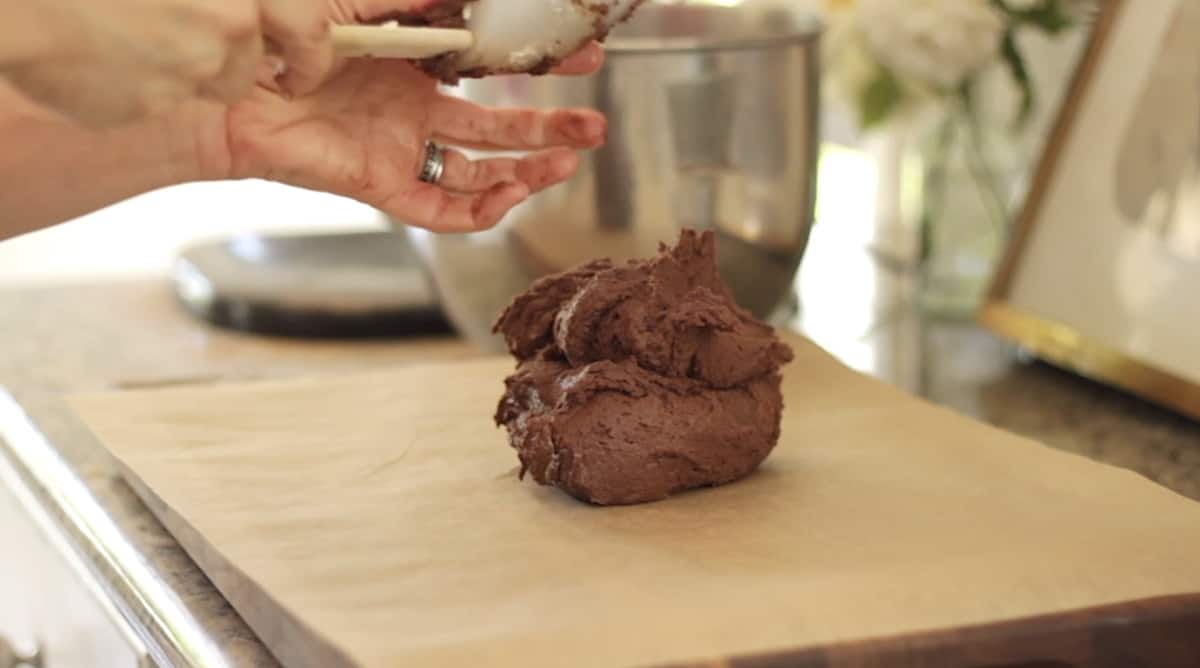 a mound of sticky chocolate cookie down on parchment paper