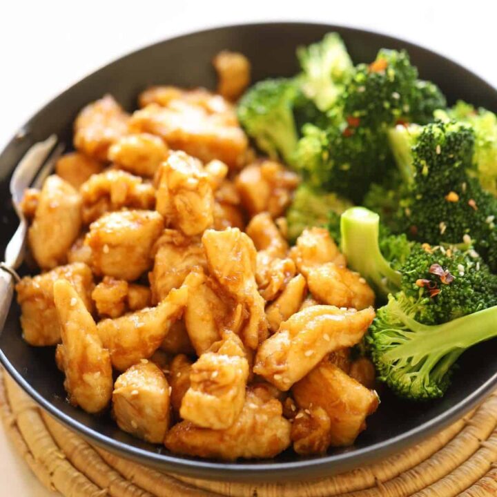 A bowl of stir fry chicken and broccoli