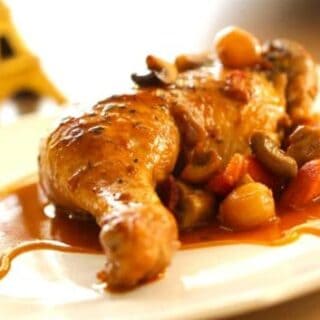 Coq au vin recipe on plate ready to be served