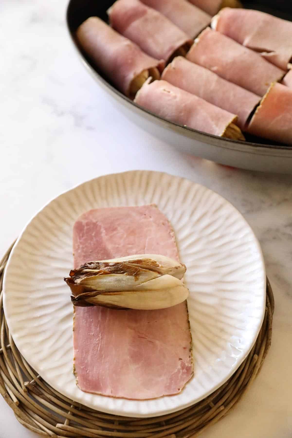 a roasted endive, on a piece of ham