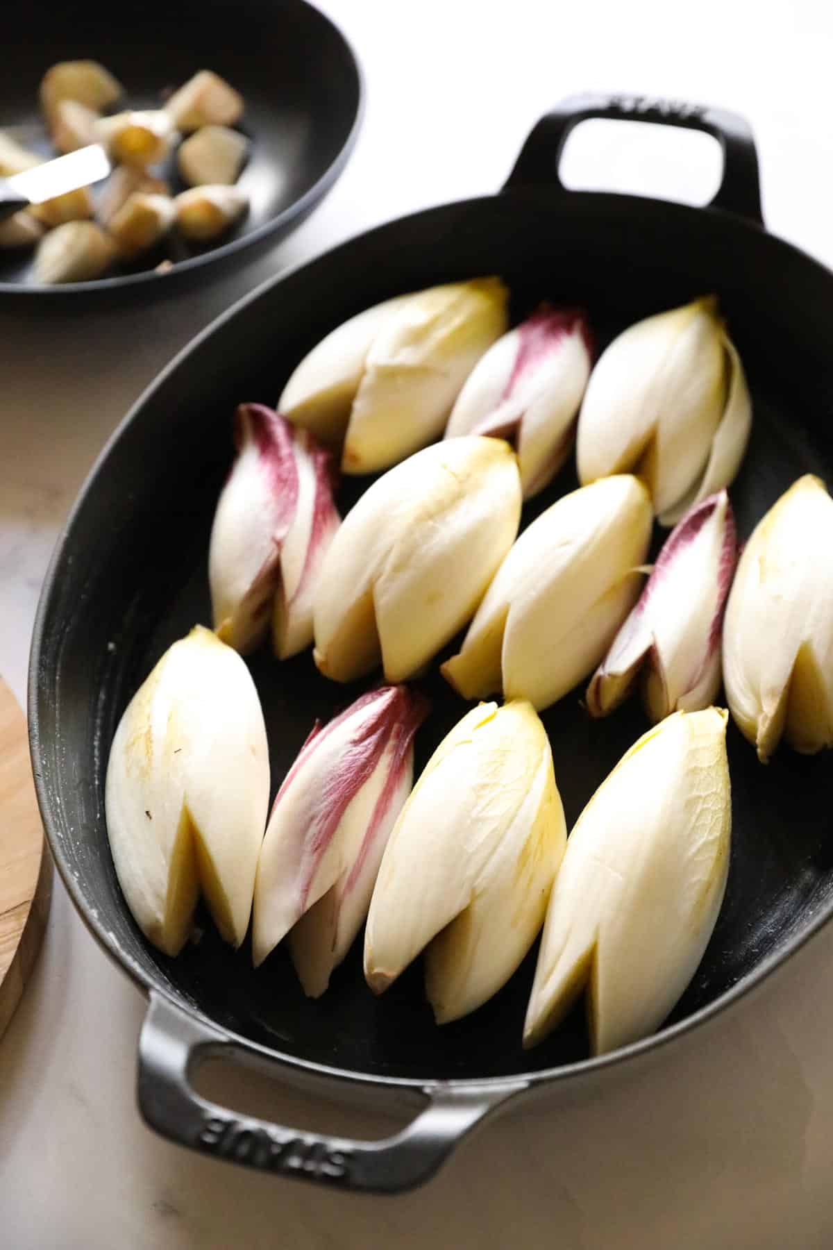 endive prepped in a casserole dish