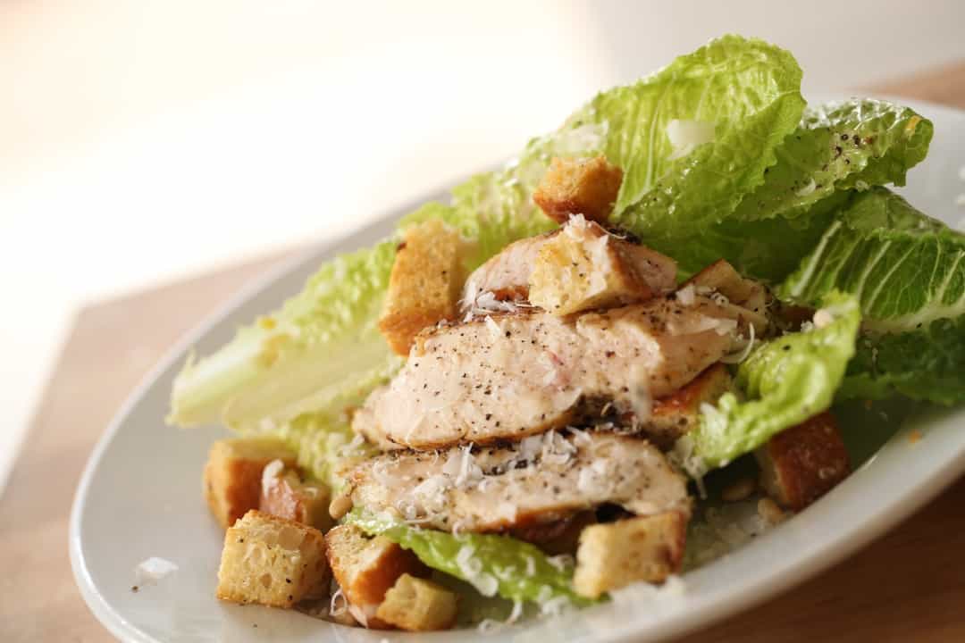 Easy Chicken Caesar Salad Recipe served on a white plate