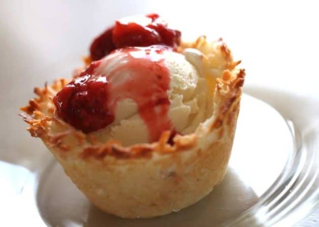 Edible Ice Cream Bowls with Strawberry Sauce served on a plate