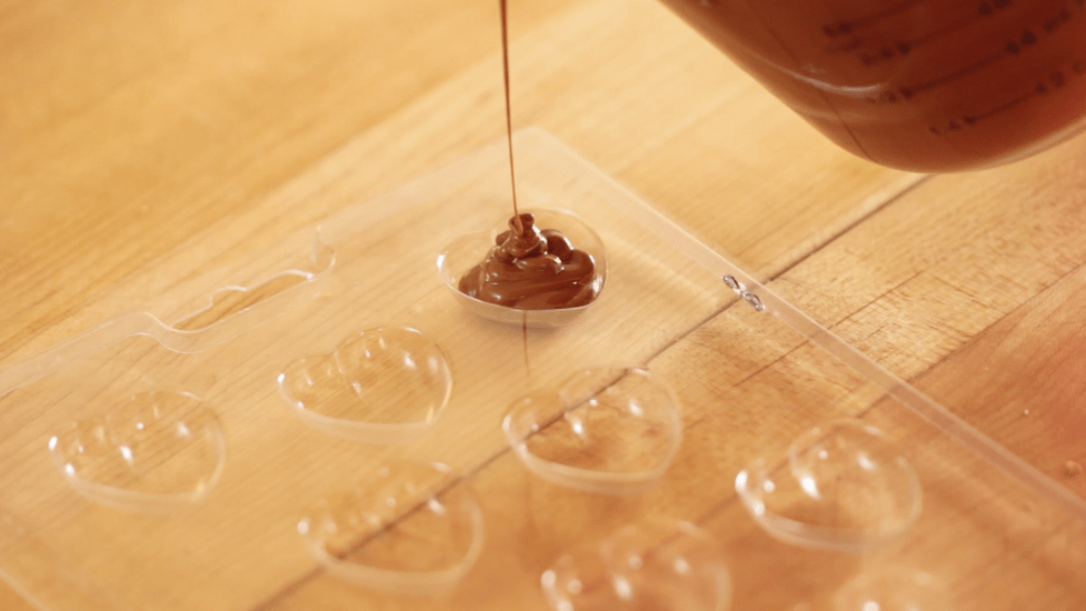 Pouring chocolate into a mold