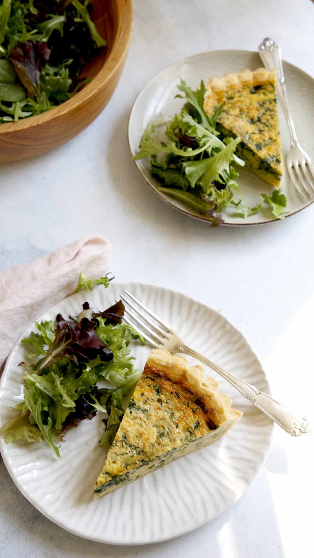 @ slices of Spinach Quiche on a plate with salad