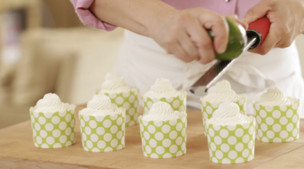 fresh lime zest is added to the top of whipped cream mounds 