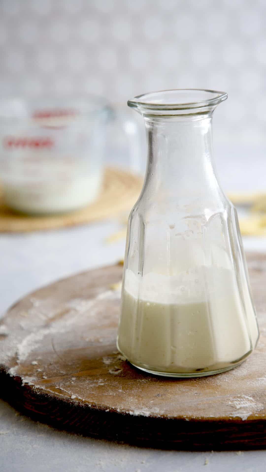 Heavy Cream in a tall decanteur and milk in the background