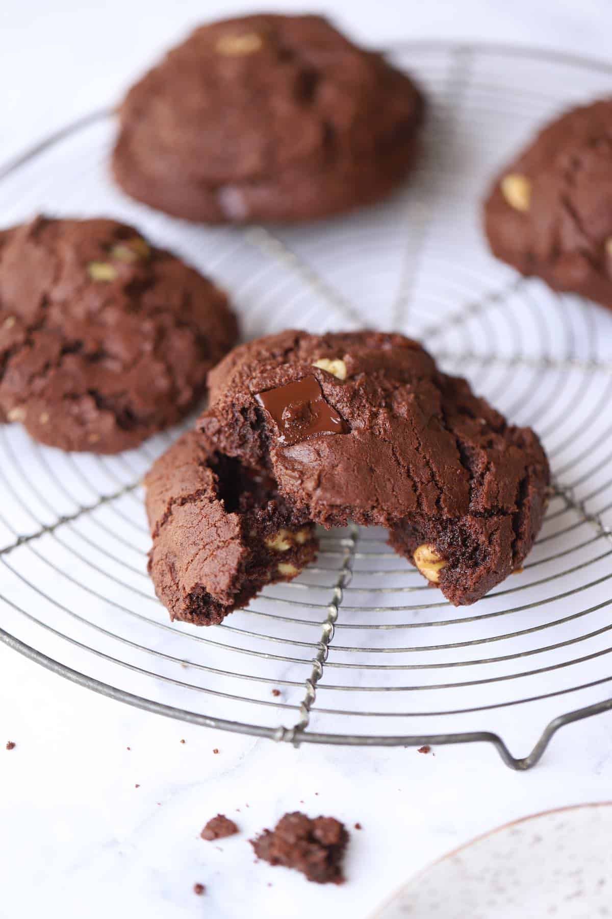 a double chocolate cookie crumbled on a cooling rack