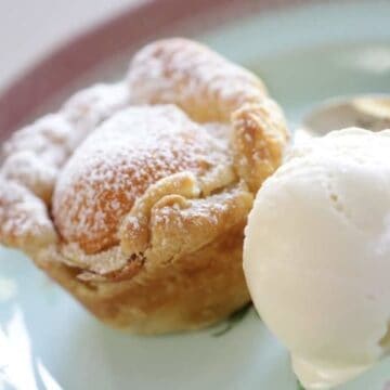 Apricot Almond Tartlette with vanilla ice cream on a blue plate