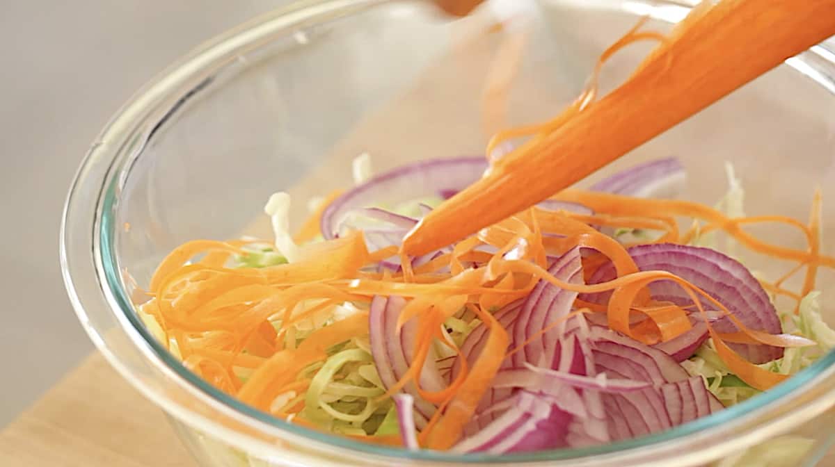 shredded vegetables in a bowl for homemade coleslaw