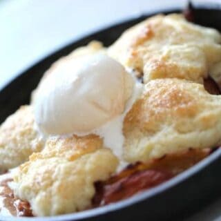 Peach Cobbler Recipe baked and served with vanilla ice cream