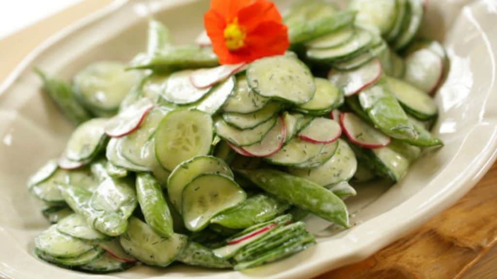 Creamy Cucumber Dill Salad Garnished with an Edible Nasturtium