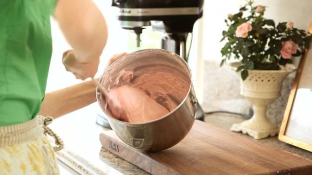 Folding Macaron Batter in a silver mixer bowl 