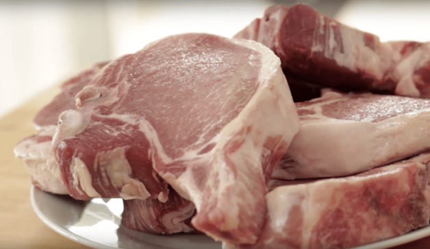 bone-in pork chops on a plate 