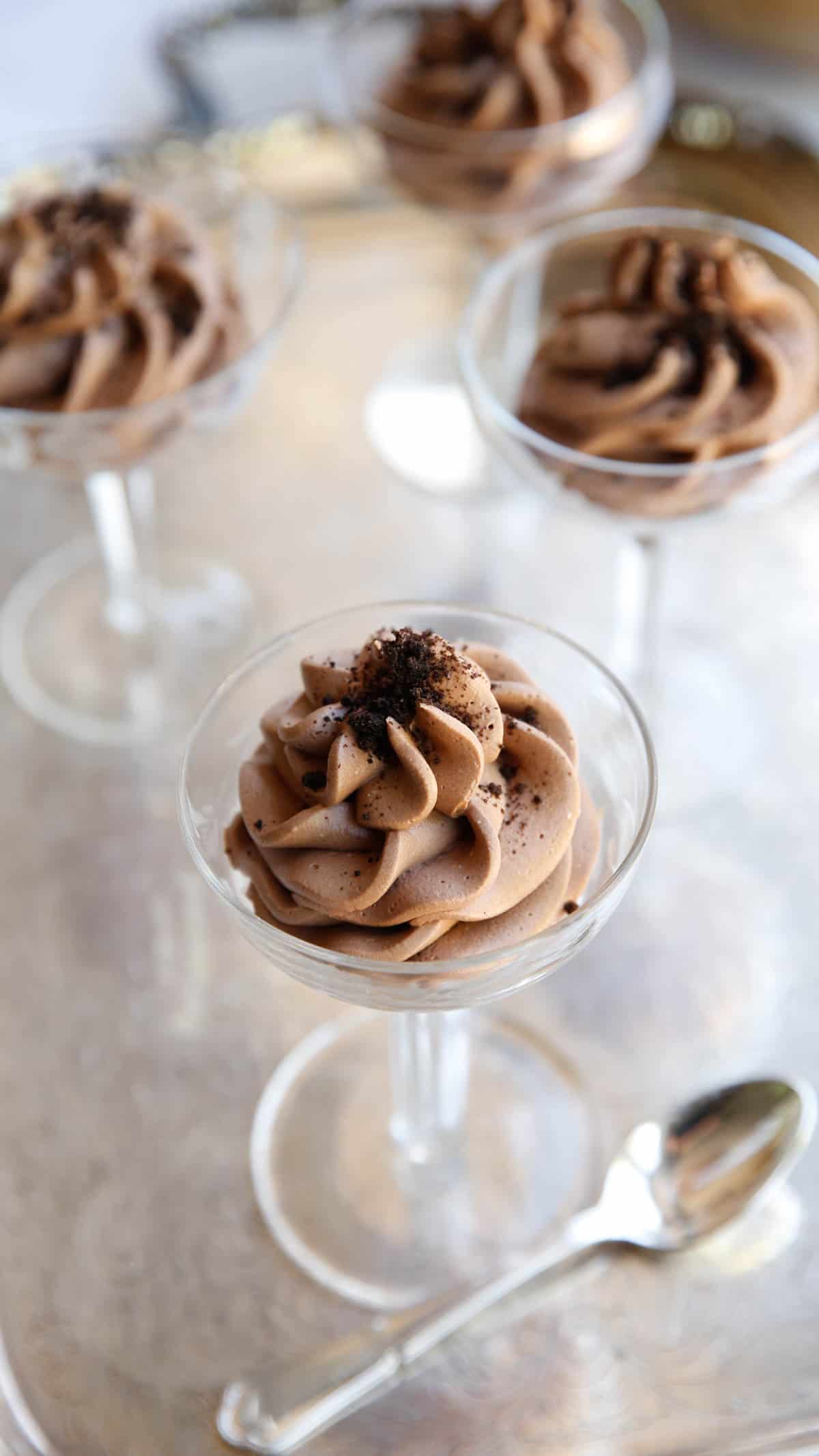 Four Glasses filled with a swirl of egg free chocolate mousse