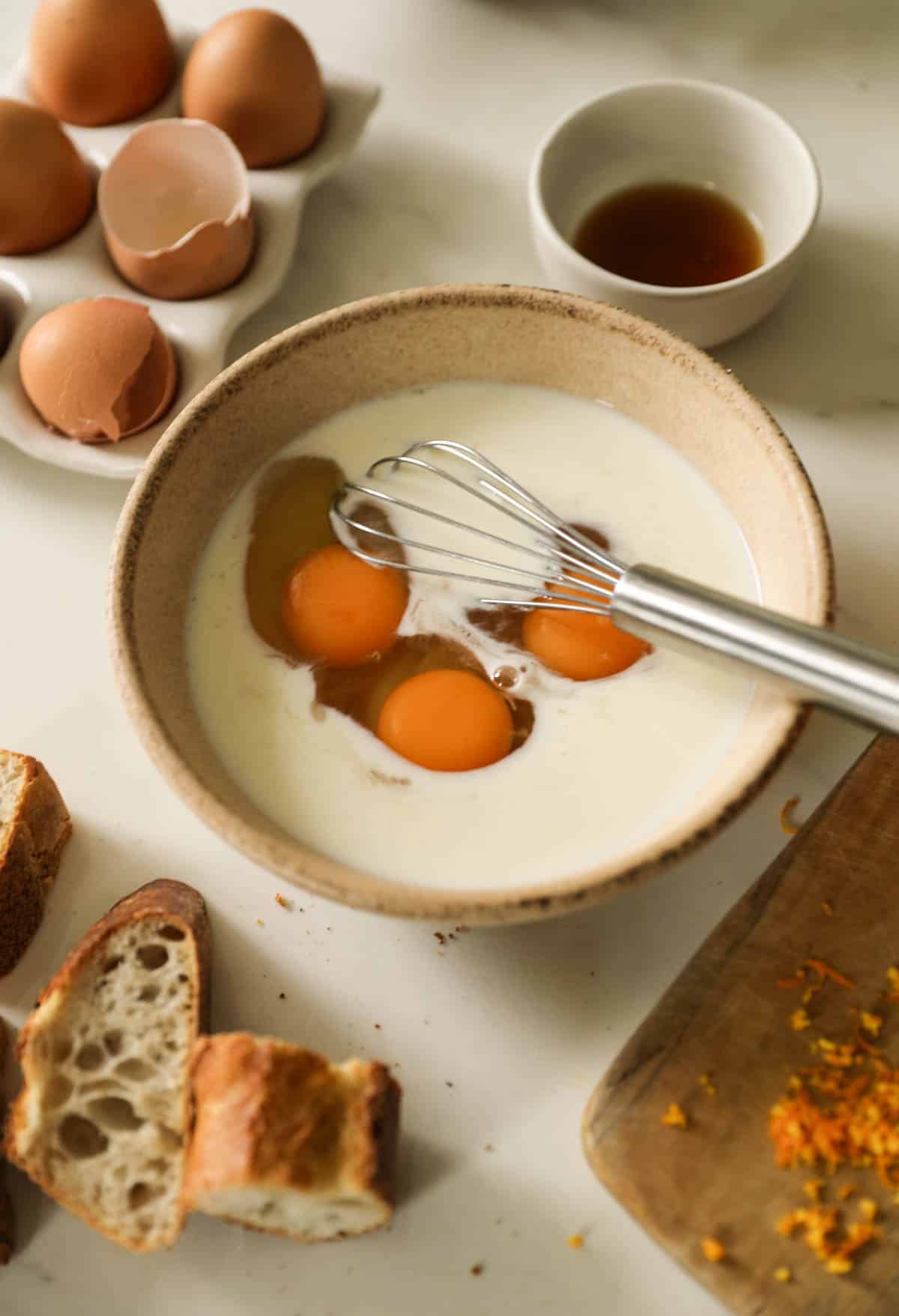 Preparing an egg bath for French toast.
