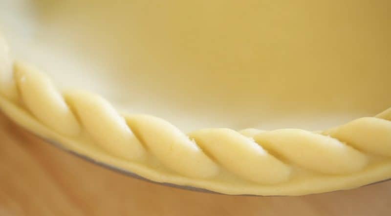 close up of pie crust crimped