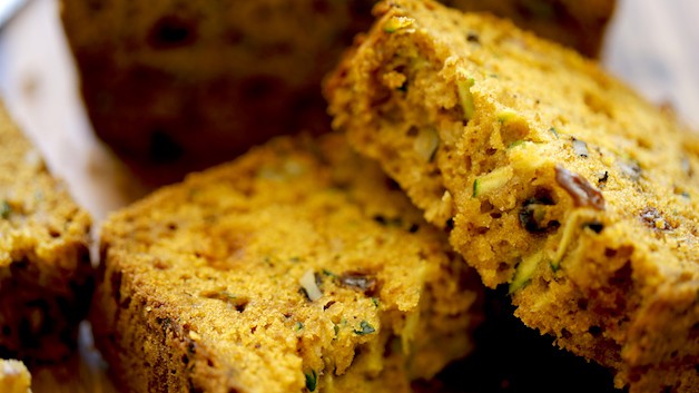 A close up of a piece of zucchini bread