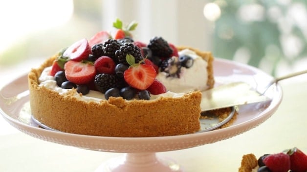 No-Bake Cheesecake with a slice taken out by a cake server