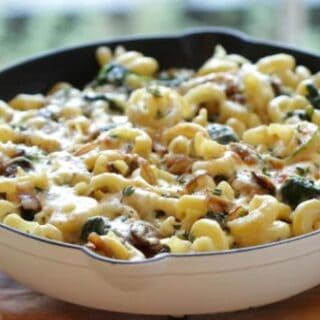 Cheesy Pasta Bake with Veggies in a large white skillet