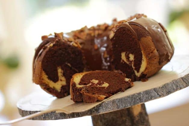 Chocolate Vanilla Marble Cake Recipe on a faux wood cake stand