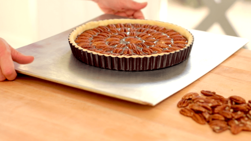 Chocolate Pecan Tart on a bakinng sheet ready for the oven 