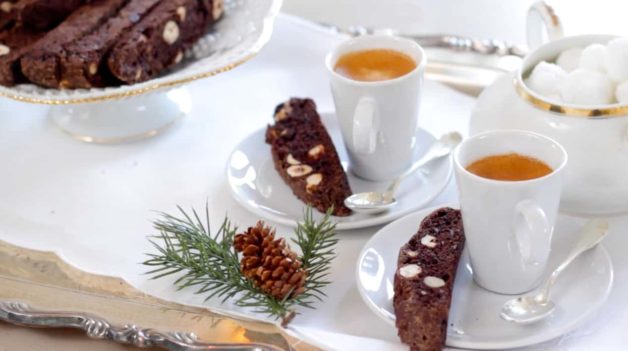 Chocolate Hazelnut Biscotti recipe served alongside a small coffee cup filled with espresso. 