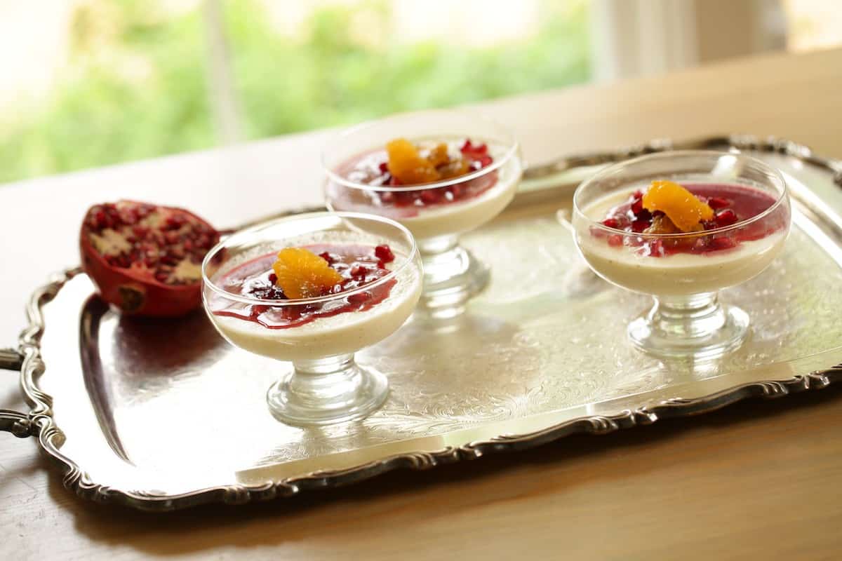 A silver tray of Panna Cotta deserts 