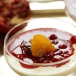Cranberry Panna Cotta Recipe in a small footed glass dish