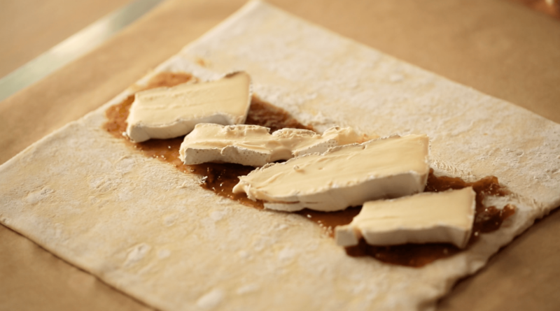 Brie and fig jam on a sheet of puff pastry