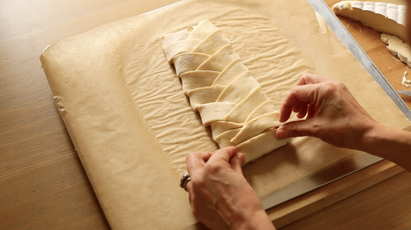 A brie and fig braid braided together and looking like a little mummy