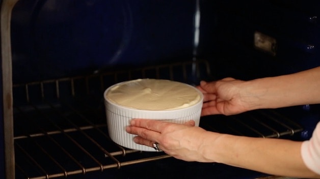 Placing souffle dish in the oven 