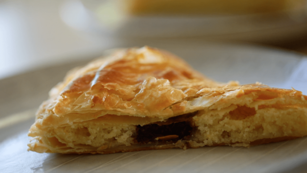 Galette des Rois slice showing the chocolate hidden inside