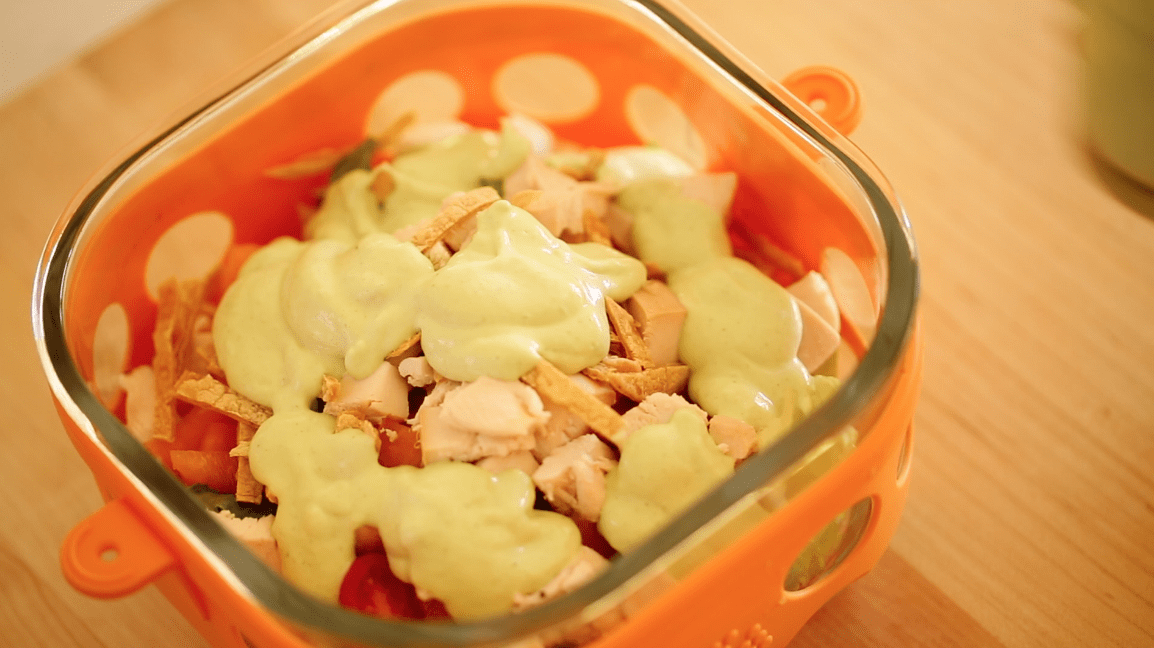 a Southwestern Chicken Lunch Salad in an Orange Container