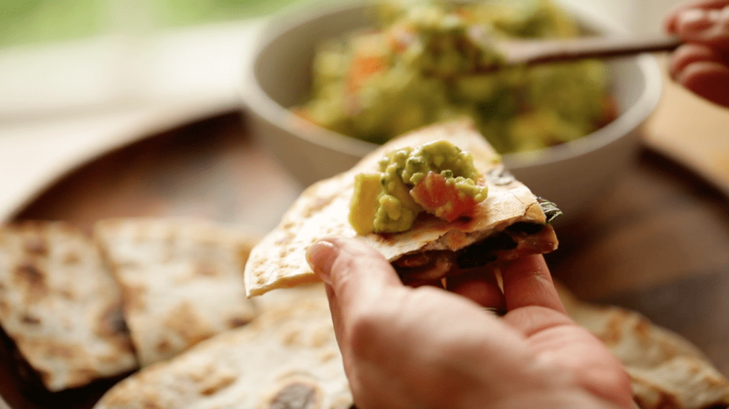 guacamole on top of a veggie quesadilla recipe