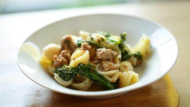 Orecchiette Pasta with Sausage and Baby Broccoli served in a white bowl