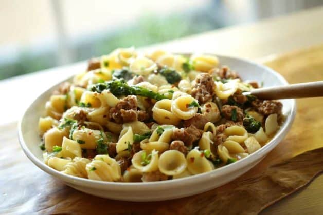 Orecchiette Pasta with Sausage and Baby Broccoli served family style in a large bowl