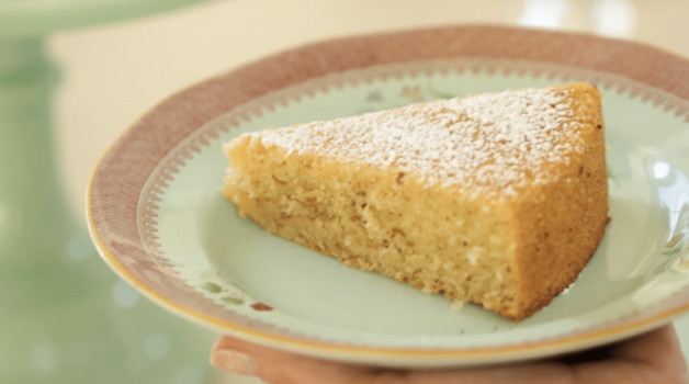 Orange Almond Cake slice on a green plate