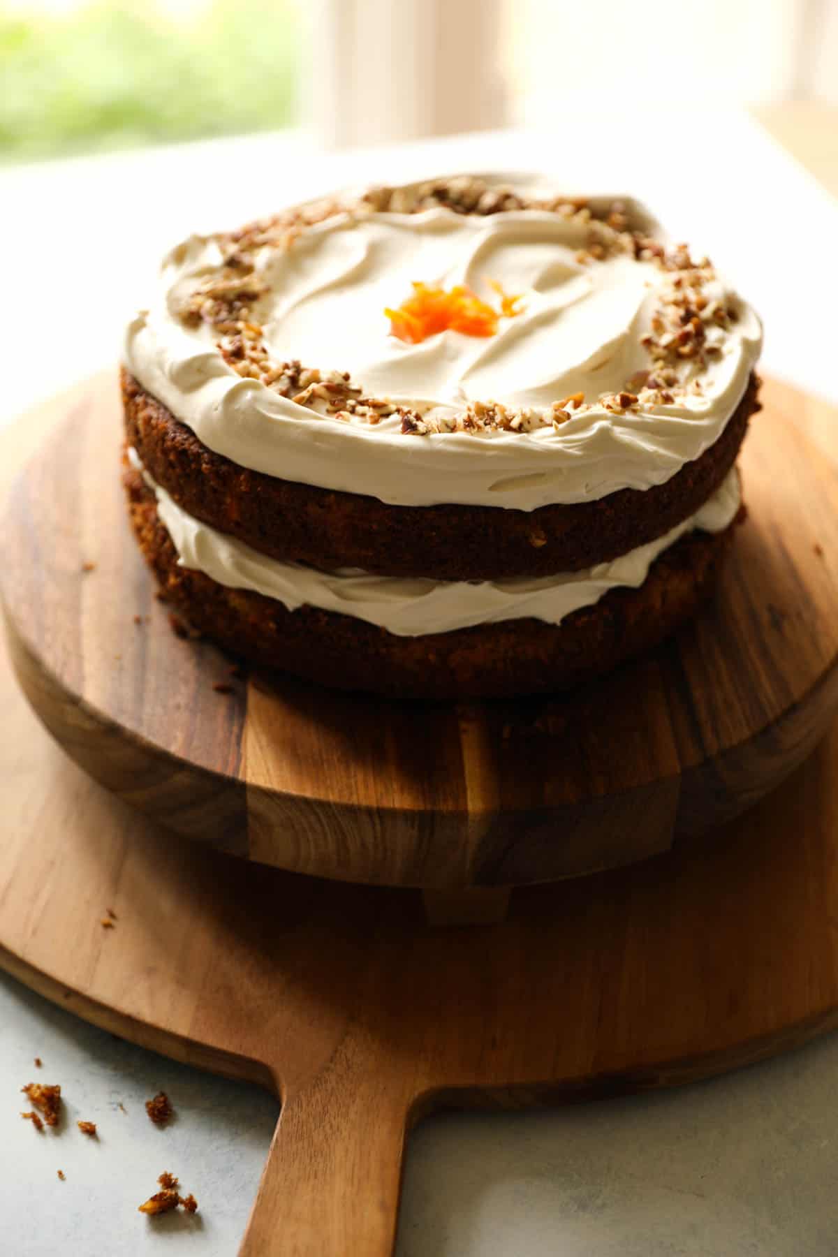 carrot cake assembled with 2 layers and cream cheese icing