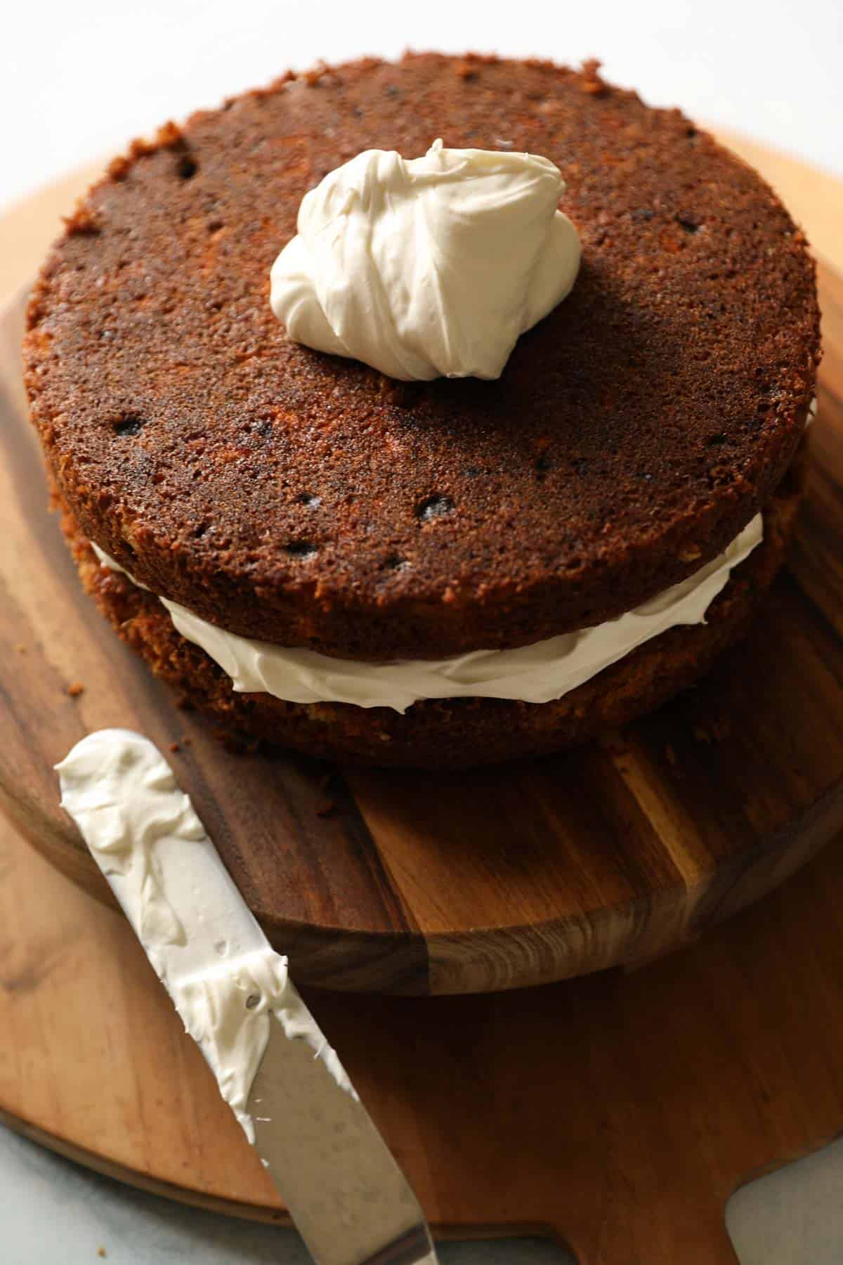 2 layers of carrot cake with cream cheese frosting