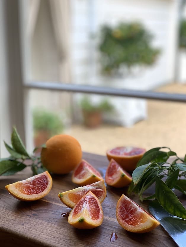 Blood Oranges Sliced on Board in front of window